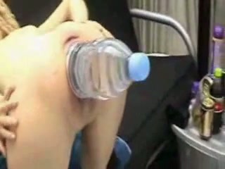 My horny wife enjoys having a big bottle in her cunt