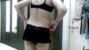 Hot sissy crossdresser femboy Sweet Lollipop in short skirt and bra.