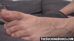 Athletic man masturbates using both hands and foot stimulation