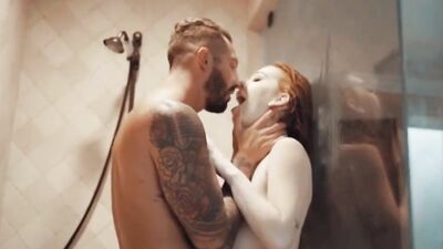 Ginger vixen and her handsome boyfriend are taking a shower and having passionate sex