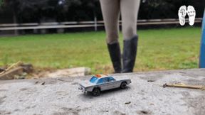 Toy Cars under her old riding Boots