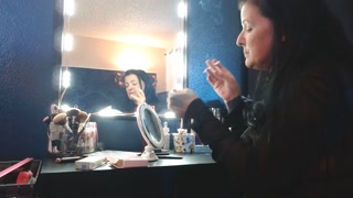 Dangling Long Virginia Slims 120 Cigarette Doing Makeup Smoking Hands Free