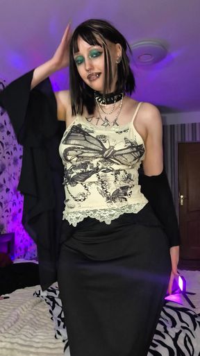 Goth babe offers her curvy, black-clad body to satisfy your desires