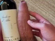 Comparing my big cock to a wine bottle