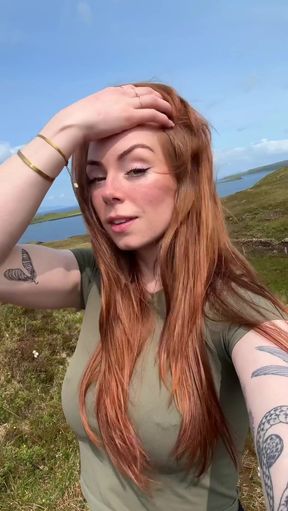 Woman with red hair outdoors