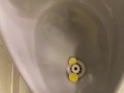 Destructive pissing in public urinal