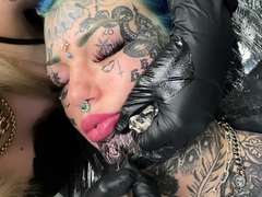 Australian bombshell Amber Luke gets a new chin tattoo