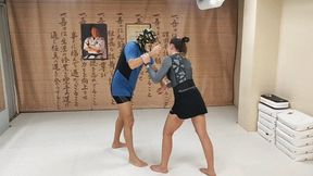 BJJ girl wrestles a guy