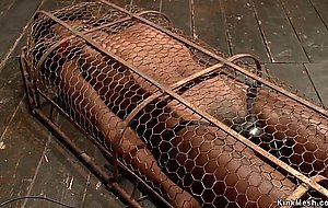 Ebony slut in small cage gets vibrated