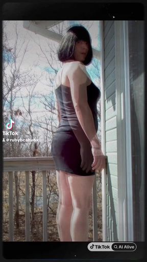 Trans sissy in a black mini dress