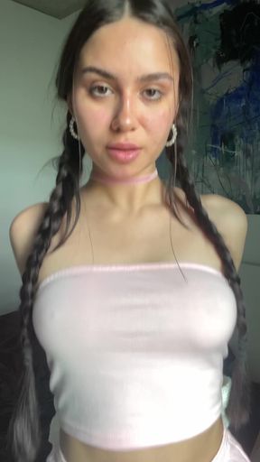 Playful braless babe teases in a video
