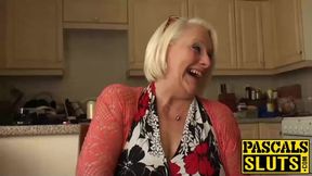 British mature blonde granny Carol fingers her wet pussy