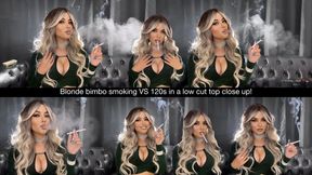 Blonde bimbo smoking VS 120s in a low cut top close up!