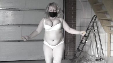 A mature bbw milf with a hairy pussy and big saggy natural tits is jumping rope.