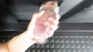 Massaging clients penis with a plowed sleeve (milking table) Noisy stroking sounds with lots of cum.