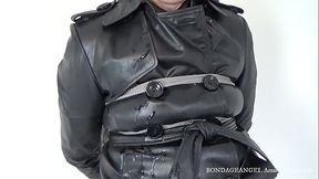 Mistress in a leather coat tied to a chair