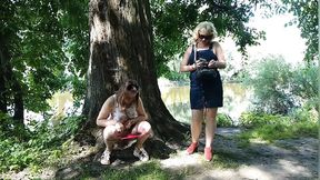 Two girls stopped on the side of the road to pee &mdash;  attracting the attention of passing cars &mdash;  golden shower in a public place