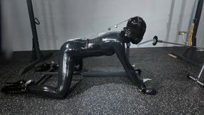 Latex clothing and metal bondage gear