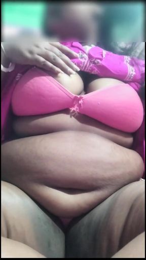 A Bengali woman quenches her thirst with a bottle   Clip 1