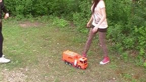 two girls crush a car