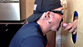 Gloryhole gay enjoys jerking while sucking big dick