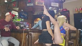 Girls fucking each other with strapless dildo while husbands watch