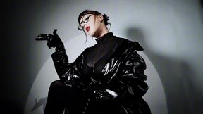 SMOKING IN PVC TRENCHCOAT AND LATEX GLOVES