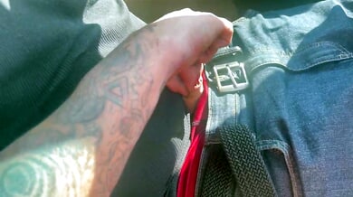 Amanda gives a gripping roadside handjob to a man in a red shirt on the interstate