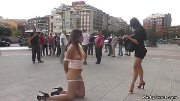 Brunette hottie licking mistress in public