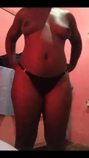 Young Ugandan girl showing off