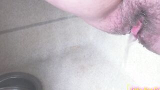 Peeing inside the sink inside the kitchen