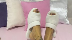 sensualizing feet in cotton slippers