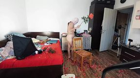 An amateur woman cleans the house with the vacuum cleaner  Sexy mom has fun with naked roses
