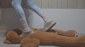 Mickee tramples big stuffy with slippers and fuzzy socks