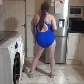 wife dancing sexy blue in swimsuit and sneakers