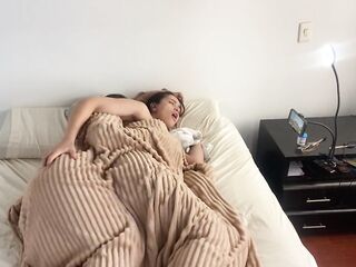 Lesbian sex under the covers on a cold morning