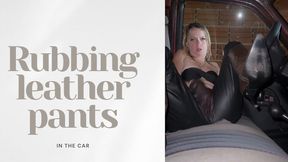 in the car rubbing leather pants
