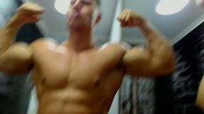 Muscle Flexing and Sucking Cock