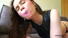 blowing juicy bubbles in tight latex top