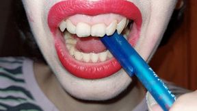 Biting a blue pen