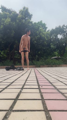 A young man publicly displays his erect penis.