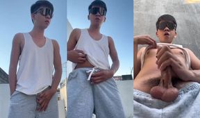 Asian cutie in grey sweatpants jerks off his veiny cock while moaning