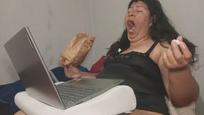 Yawning While Eating Popcorn in Bed – Tired Girl With Laptop