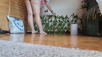 Italian housewife vacuums carpet