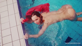 Adorable brunette teen swimming naked