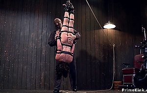 Laid and shackled slut gets whipped