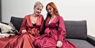 We present their new video, in which they both are wearing red sating gowns, nylon seamed stockings