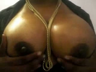 Closeup view of my stunning ebony MILF wife's huge black tits