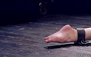 Shackled blonde slave gets whipped
