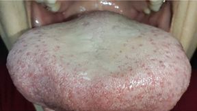 Large, dirty Asian tongue in close-up.